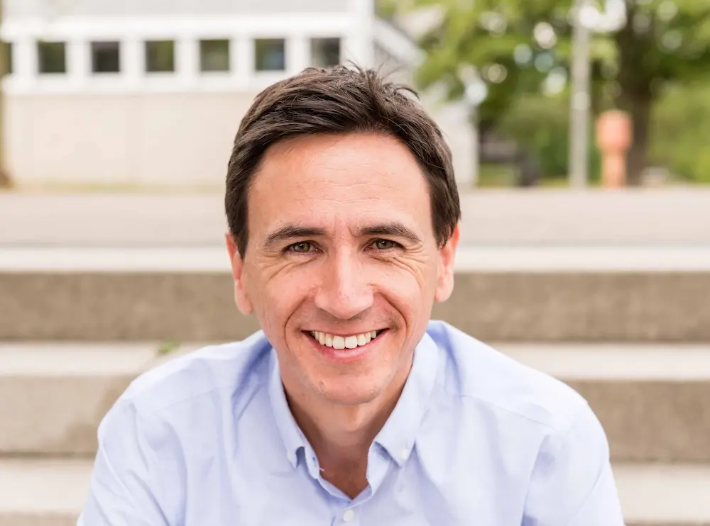 Photo of Adrian Neumeyer. He is the CEO of Caperity, a light-weight resource management software for project-driven teams.